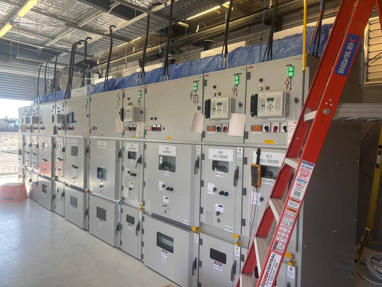 A switchroom aisle lined with switchgear panels