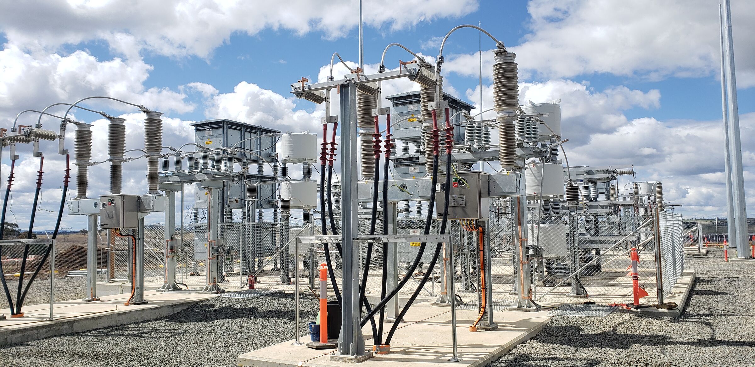 A switchyard under construction, structures and primary plant in place